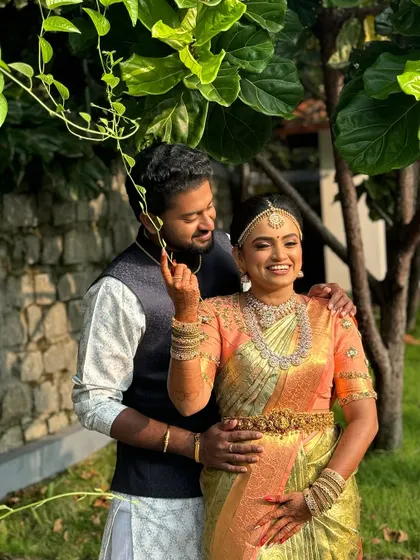 Capturing the joy of the big day. The bride's radiant smile is the centerpiece, enhanced by a flawless makeup look that highlights her natural features.