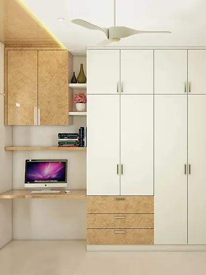 A clean and simple wardrobe design that incorporates an open study desk. The dual-tone finish adds visual interest while providing ample storage and a functional workspace in a compact room.