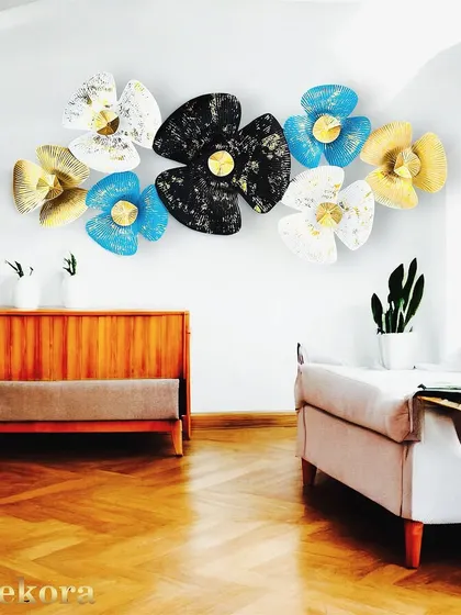 A multi-colored floral arrangement in blue, gold, black, and white, creating a playful yet sophisticated piece of wall art.