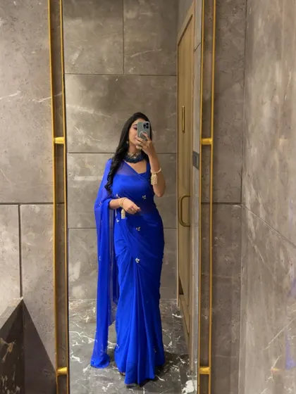A selfie in a simple yet elegant royal blue saree, showing a classic look for any occasion.
