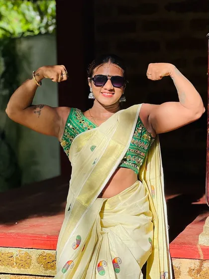 Onam festival vibes during bulking season. Even during off-season and celebrations, the commitment to strength is always there, showcased here with a double bicep pose.