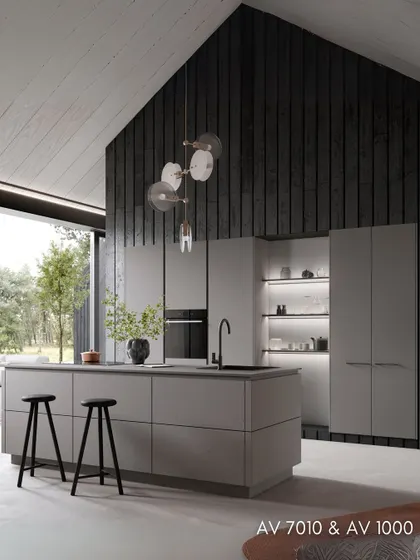 This kitchen features a sleek, minimalist design with grey concrete and greige laminate fronts, set against a dramatic dark wood-paneled wall.