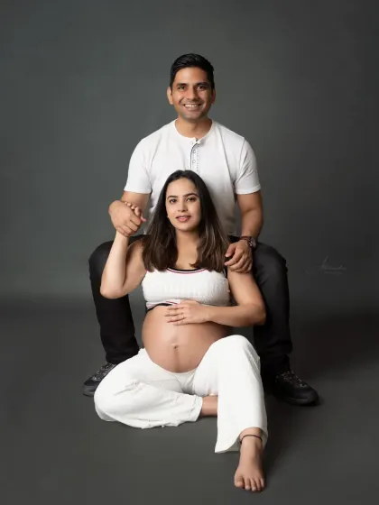 A relaxed and happy portrait of the couple. Their comfortable poses and genuine smiles make this a warm and inviting image.