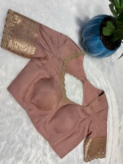 Another view of the elegant nude-peach blouse, a versatile piece for any wardrobe.