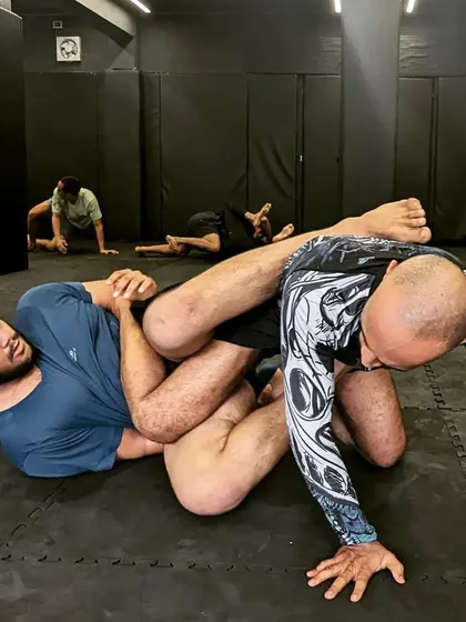 A fighter attempts to secure a dominant position during a grappling session. We focus on positional control as much as submissions in our BJJ and wrestling classes.