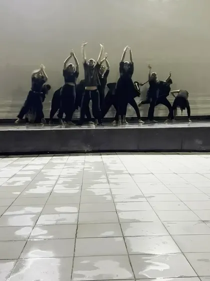 A powerful contemporary performance on an outdoor stage, even in the rain. Our dancers' commitment shines through no matter the circumstances.