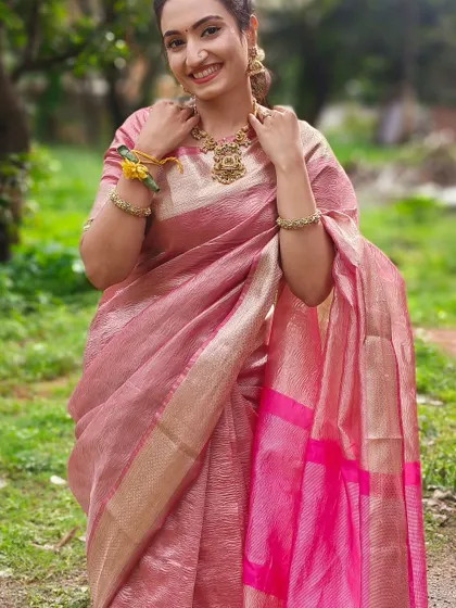 Actress Vaishnavi Gowda in a lovely pink linen saree. I designed a simple, matching blouse to go with it, letting the texture of the saree and the beautiful temple jewelry be the main focus.