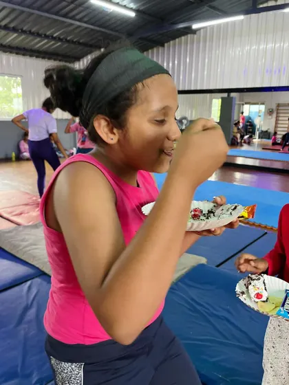 Savoring every bite. The joy on her face is what our community celebrations are all about.
