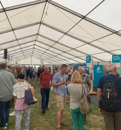 A view of the bustling Global Birdfair, the world's largest gathering of birders. Our presence here reinforces our commitment to being a leader in ecotourism and conservation travel.