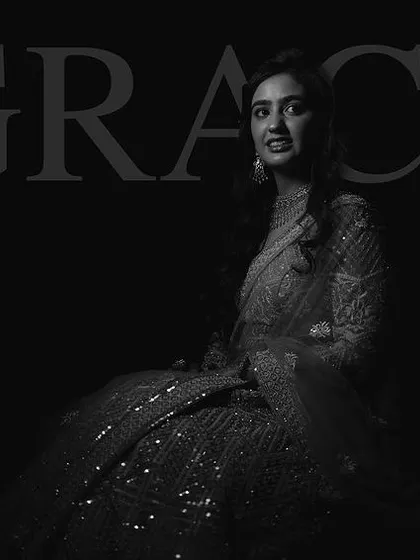 A graceful black and white portrait that highlights the elegance of the makeup and the client's features.