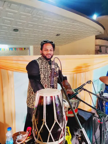 At a show with Vijay Prakash Sharma. I am holding my dholak, ready to add the percussion beats.
