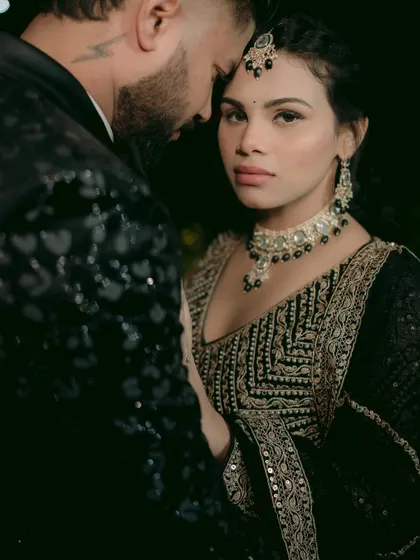 A powerful and intimate portrait, with the bride looking directly at the camera, conveying confidence and emotion.