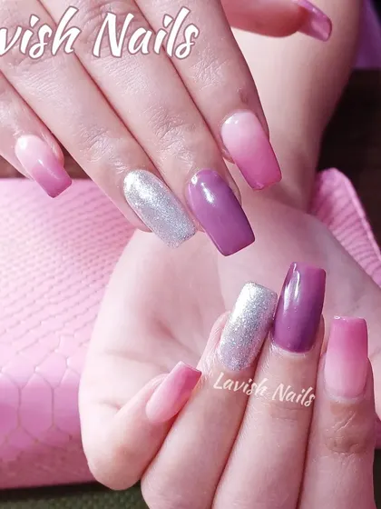 A colorful set featuring purple, pink ombre, and a full-coverage silver glitter accent nail.