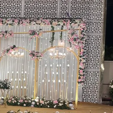 A side view of the elegant floral and light stage decor, showing how the elements come together to create a layered and dimensional backdrop.