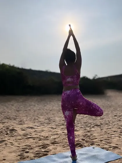 Rooted like a tree in Vrikshasana, finding balance where the ocean meets the shore. The setting sun creates a beautiful silhouette, reminding me that we too can shine our own light.