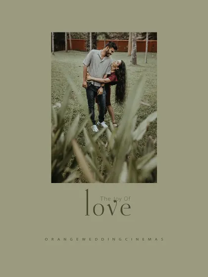 A creative shot of a couple from behind foliage, captioned "The Joy of Love."