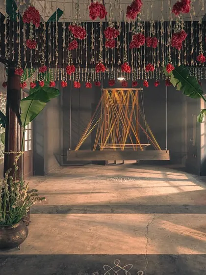 The empty mandap, set for the ceremony. The swing and the thread installation symbolize the loom, connecting the bride's journey back to the weaver's craft.