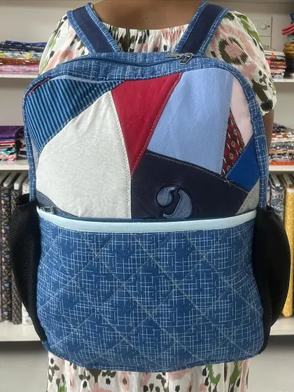 A full front view of the upcycled T-shirt backpack.