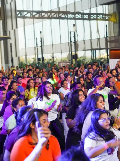 The audience dancing along. It's amazing to see everyone moving together.