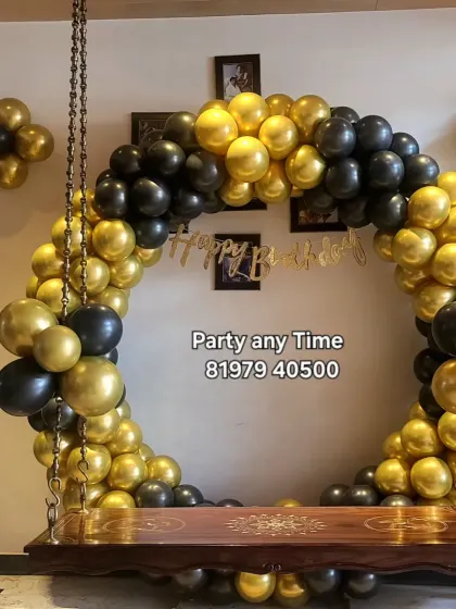 Another angle of the balloon arch on the swing, showing how it transforms a part of the home.