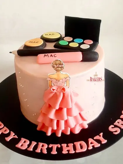 A gorgeous makeup cake for Srishti, a big fan of MAC cosmetics. This minimal-fondant cake is topped with edible makeup items like eyeshadow palettes and lipstick.