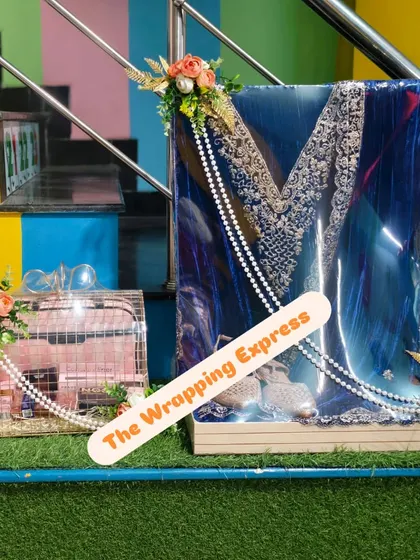 A full view of the packed blue velvet suit and the cosmetic hamper, showing how they look together as a set.