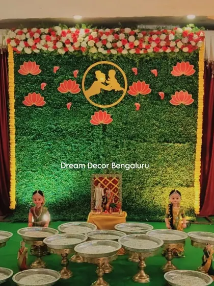 This is a great example of a budget-friendly package. It includes an artificial grass wall, floral border, traditional dolls, and plate stands for a complete Seemantham setup.