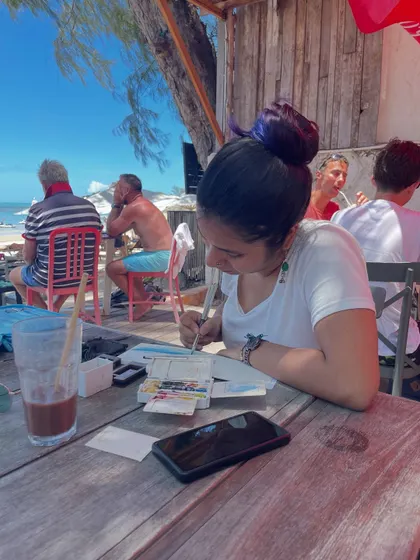 Painting at a beachside cafe. My on-the-go art kit allows me to set up my studio anywhere, anytime, and capture life as it happens.