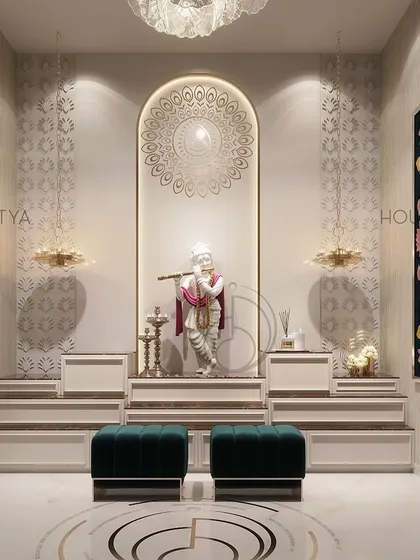 A serene and elegant pooja room, adorned with intricately designed deities and a beautiful chandelier. The design creates a tranquil ambiance perfect for meditation and worship, making it a peaceful retreat within the home.