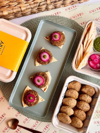 My ready-to-cook Galouti Kebabs are perfect for an easy yet impressive appetizer. The image shows the kebabs before and after cooking, served on mini flatbreads with pickled onions and mint chutney.
