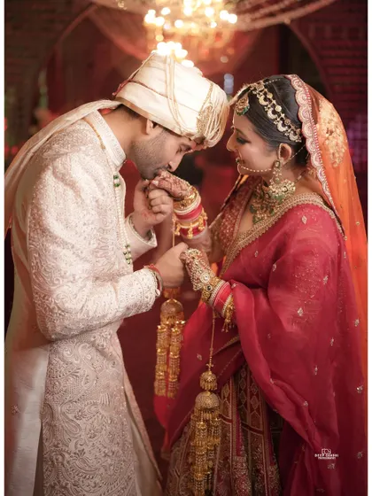 A tender moment between the bride and groom. The groom's gentle kiss on his bride's hand is a classic, romantic shot we love to capture.