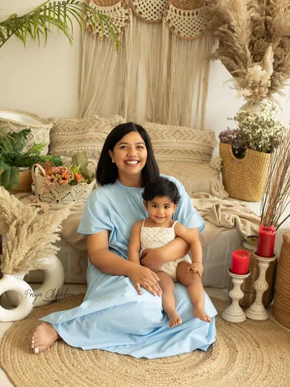 Two hearts, one love. A mother and daughter share a quiet moment in our beautiful boho-themed studio setup, surrounded by natural textures and soft light.