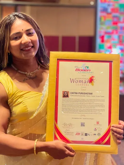A closer look at my Karnataka Women Leaders award. This recognizes my work as a professional bodybuilder, fitness trainer, and karate trainer.