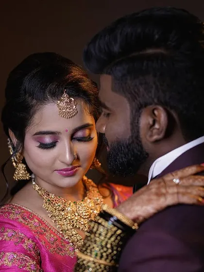 A close-up, romantic portrait of a couple at their reception. I use controlled studio-style lighting even during live events to create these polished, magazine-worthy shots that highlight emotion and detail.