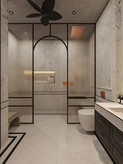 A closer look at the shower and toilet area, showing the frosted glass for privacy and the continuation of the black and white floor pattern.