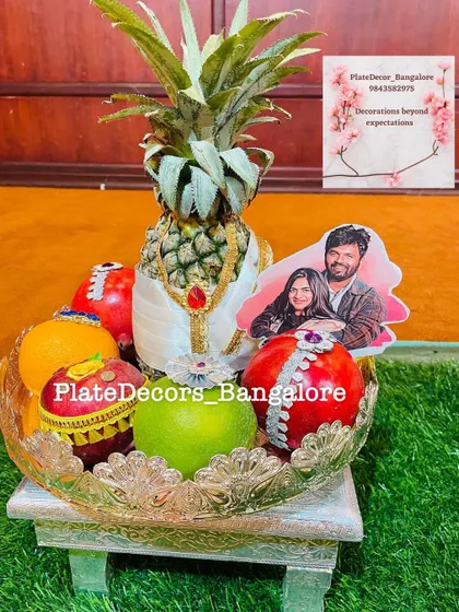 A personalized wedding platter featuring a pineapple groom and a custom photo cutout of the couple. I can incorporate your photos to make the gifts truly unique.