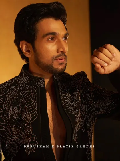 Another powerful shot of Pratik Gandhi in the black embroidered jacket. The look is sharp, structured, and designed to be unforgettable.