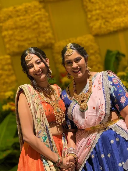 A happy client moment featuring my orange silk skirt set. The skirt has a hand-painted border and is paired with an embroidered blouse and a stunning Kashmiri embroidered georgette dupatta.