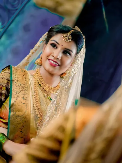 The joy of seeing your final bridal look is unmatched. This bride's radiant smile reflects her confidence and excitement for the day ahead.