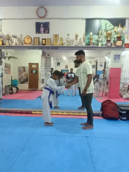 A respectful bow after receiving a new blue belt.
