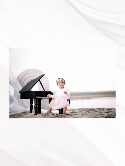 A beautiful portrait of a little musician by the water. The clean, bright lighting and simple setup create a timeless and elegant feel.