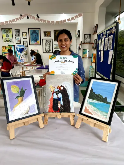 This student's final acrylic paintings include a beautiful beach scene and a depiction of Shiva, showing her creative range.