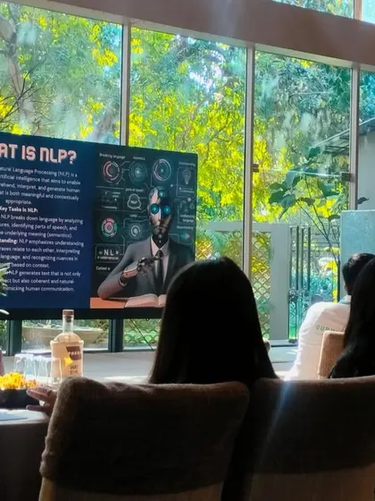 The presentation screen during the AI workshop, showing the high-tech capabilities of our event space.