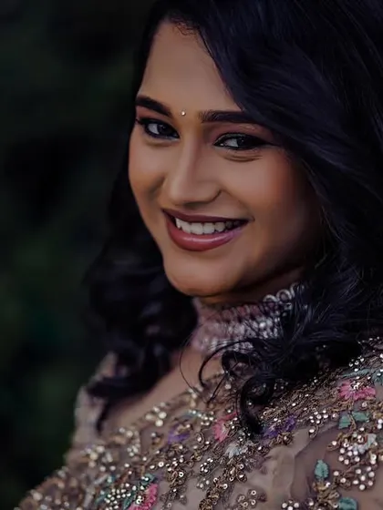 A beautiful close-up portrait of Ashwitha. The soft glam makeup highlights her features without looking heavy, perfect for a modern reception.