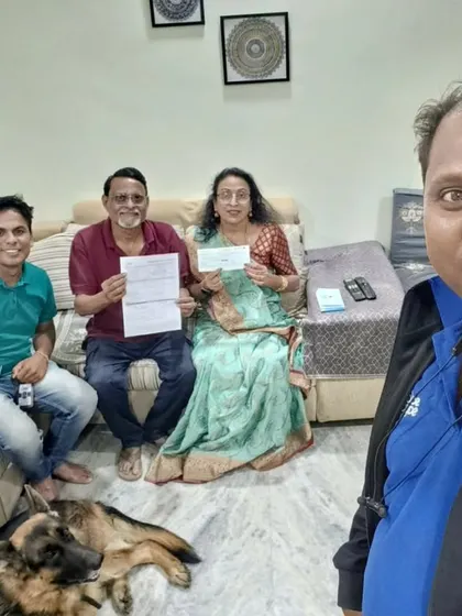 A family, including their German Shepherd, sits with our team after finalizing their solar plan. We ensure every member of the household is on board for a brighter, solar-powered future.