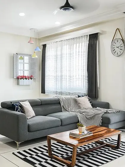 This living room was designed around a monochrome palette, creating a look that is simple, spacious, and chic. I added pops of color through small decor items and furnishings to bring personality to the black and white theme.