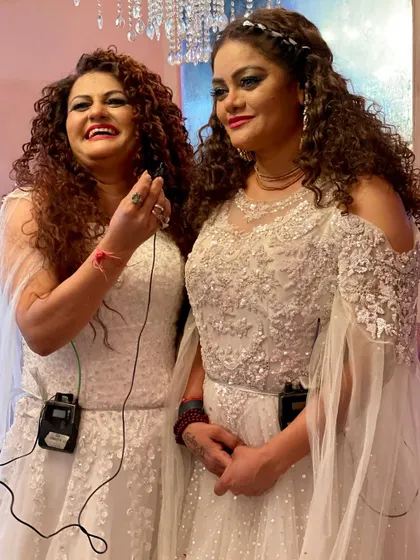 A candid moment between us during our Navratri show. Even on stage, we're just two sisters sharing a laugh and doing what we love.