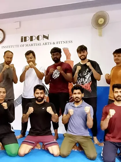 A group of our adult members after a tough weekend MMA session. The community here is strong, with everyone pushing each other to improve their striking and grappling skills.
