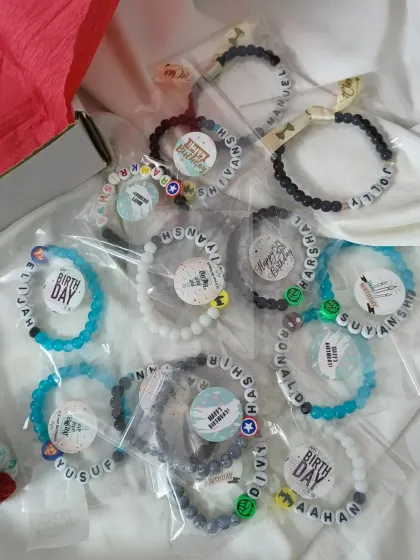 Getting a big order of birthday return favors ready! These are our custom name bracelets for boys, each individually packaged with a "Happy Birthday" sticker.