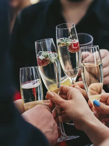 Guests toasting with flutes of champagne, capturing the celebratory spirit.